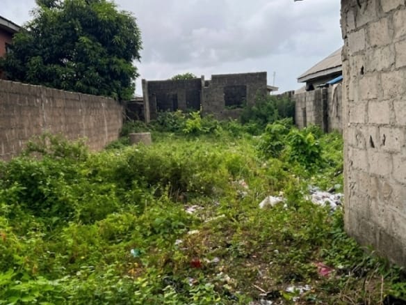 Half Plot of Land with 3-Bedroom Uncompleted Building & Shop in a Developed Area